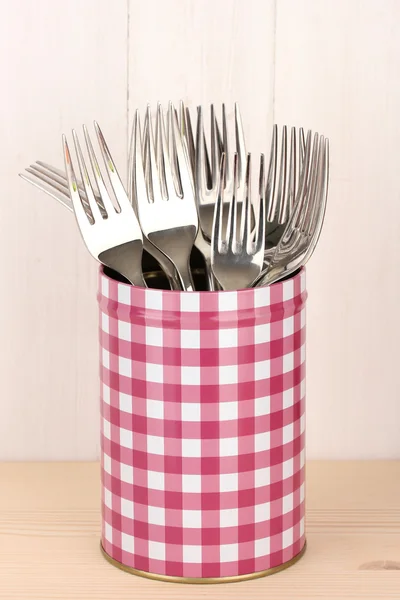 Utensils in metal containers isolated on light background — Stock Photo, Image