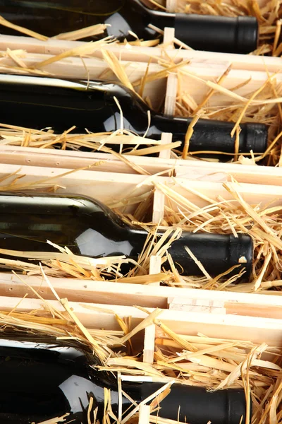Wooden case with wine bottles close up — Stock Photo, Image