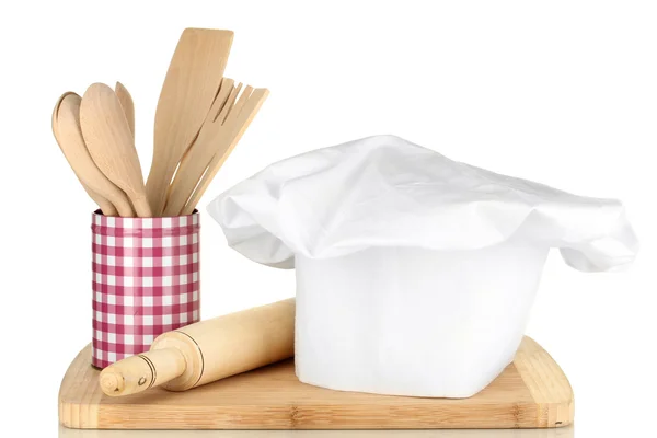 Chef's hat with spoons and battledore isolated on white — Stock Photo, Image