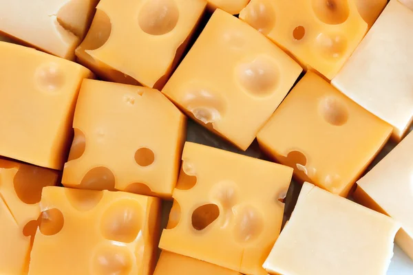Cubi di formaggio sfondo — Foto Stock