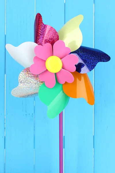 Colored pinwheel on wooden background — Stock Photo, Image