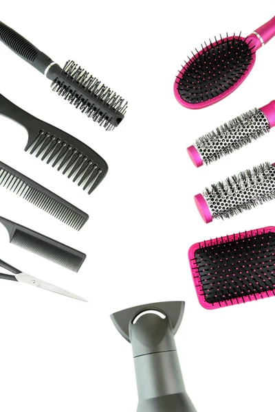 Comb brushes, hairdryer and cutting shears, isolated on white — Stock Photo, Image