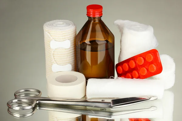 First aid kit for bandaging on grey background — Stock Photo, Image