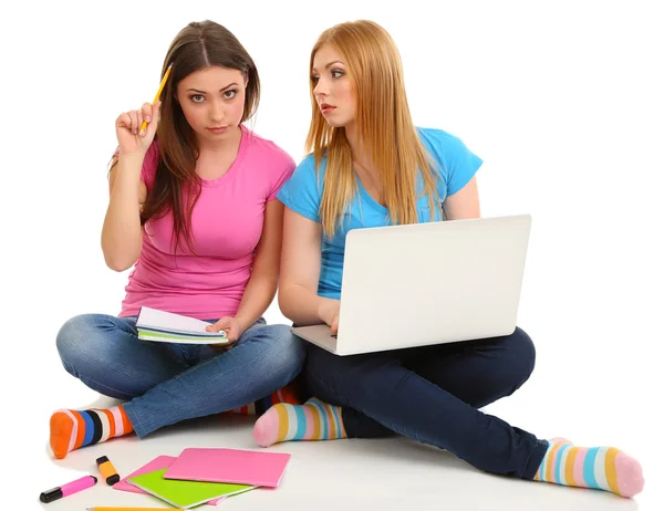 Two girl friends with with laptop isolated on white — Stock Photo, Image