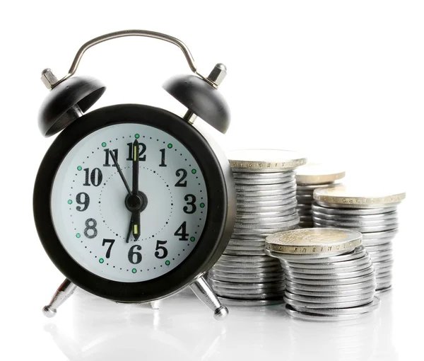 Reloj despertador con monedas aisladas en blanco —  Fotos de Stock