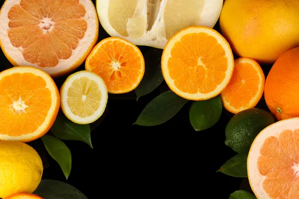 Lots ripe citrus isolated on black — Stock Photo, Image