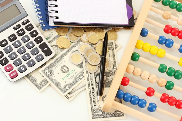 Bright wooden abacus and calculator. Conceptual photo of old and modern business — Stock Photo, Image