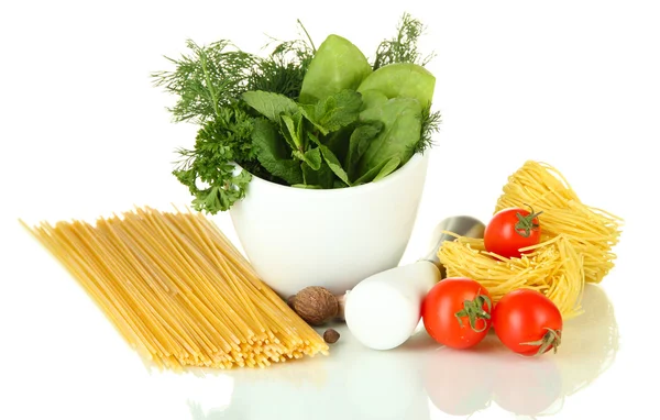 Composition of mortar, pasta and green herbals, isolated on white — Stock Photo, Image