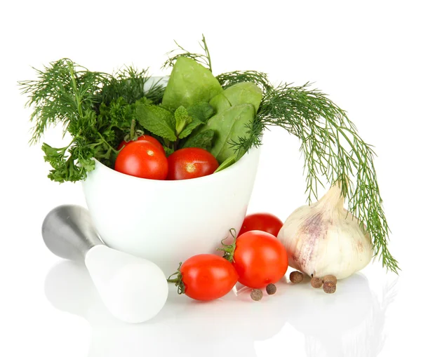 Composition of mortar, tomatoes and green herbals, isolated on white — Stock Photo, Image