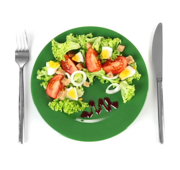 Fresh mixed salad with eggs, tomato, salad leaves and other vegetables on color plate, isolated on white — Stock Photo, Image