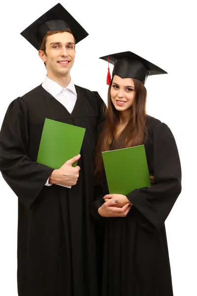 Two happy graduating students holding graduation certificate isolated on white — Stock Photo, Image