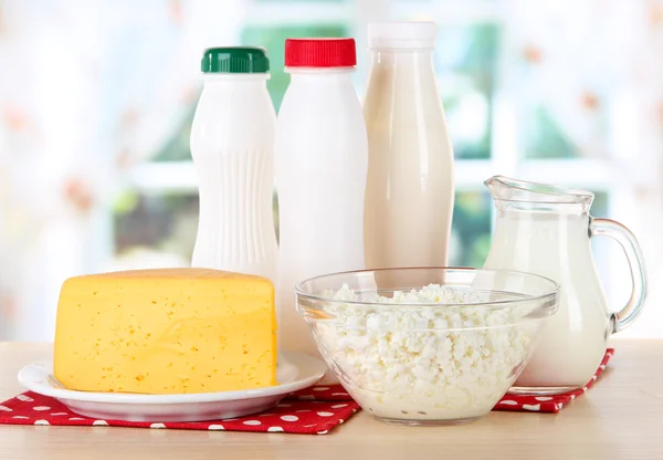 Dairy products on napkin on table in kitchen — Stock Photo, Image