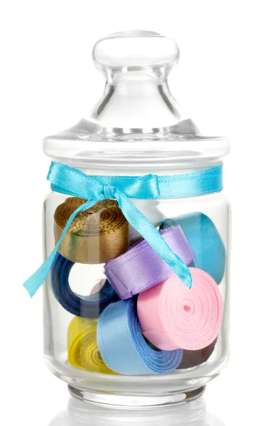 Glass jar containing various colored ribbons isolated on white — Stock Photo, Image