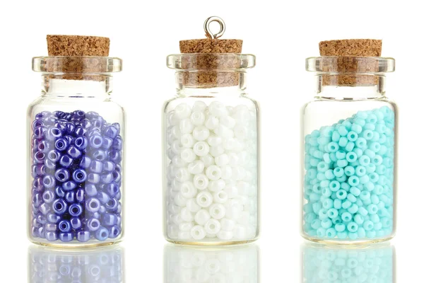 Little bottles full with colorful beads isolated on white — Stock Photo, Image