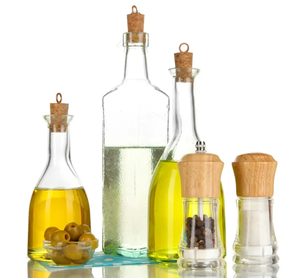 Original glass bottles with salad dressing isolated on white — Stock Photo, Image