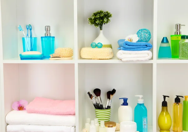 Bath accessories on shelfs in bathroom — Stock Photo, Image