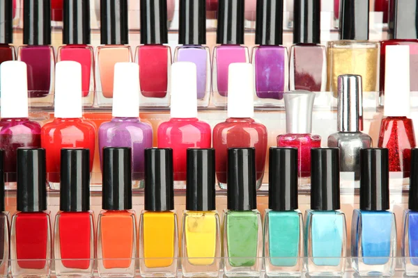 Bright nail polishes on shelf, close up — Stock Photo, Image
