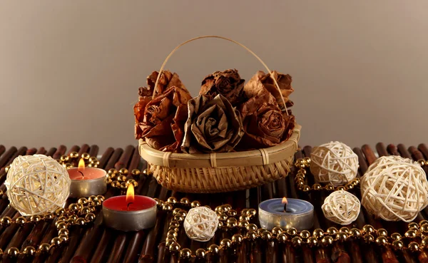 Still life with roses and candles on dark background — Stock Photo, Image