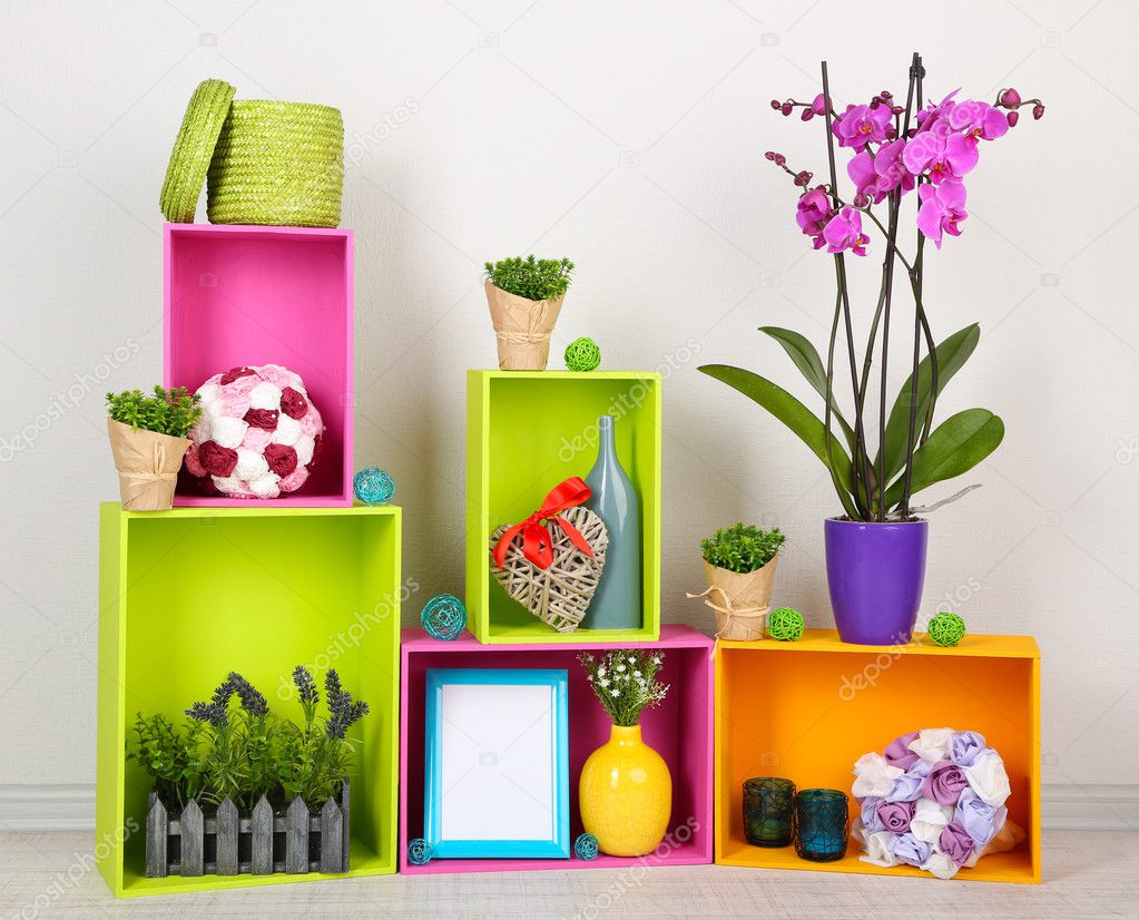 Beautiful colorful shelves with different home related objects