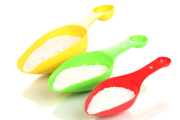 Washing powder in measuring cup isolated on white