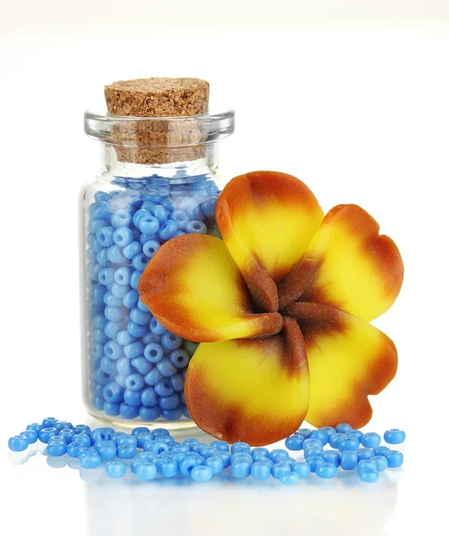 Little bottle full with colorful beads isolated on white — Stock Photo, Image