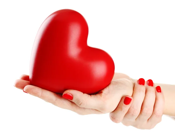 Czerwone serce w ręce kobiety, na białym tle — Zdjęcie stockowe