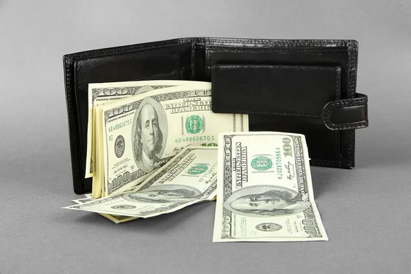 Wallet with hundred dollar banknotes, on color background — Stock Photo, Image