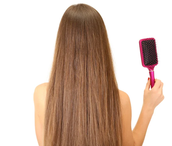 Retrato de mulher bonita com cabelo longo e uma escova de cabelo, isolado em branco — Fotografia de Stock