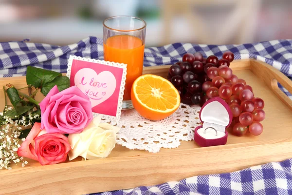 Breakfast in bed on Valentine's Day on room background — Stock Photo, Image