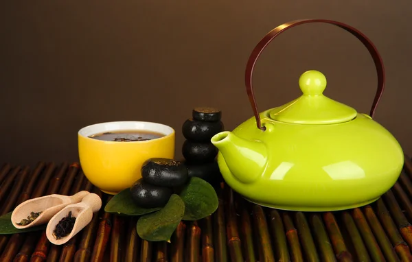 Chinese tea ceremony on bamboo table on brown background — Stock Photo, Image