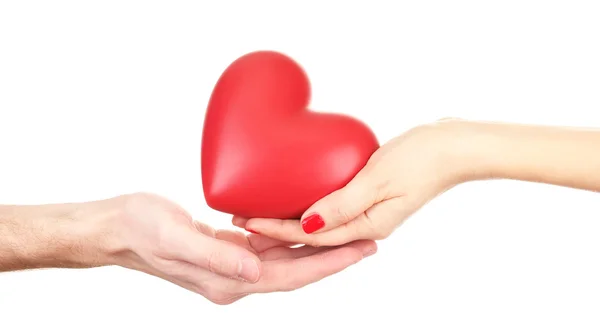 Rött hjärta i kvinnan och manen händer, isolerad på vit — Stockfoto