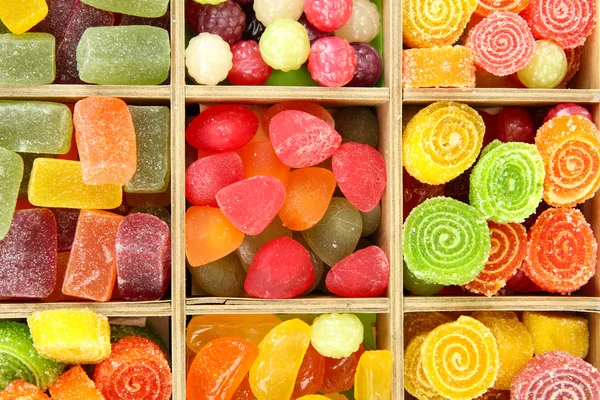 Multicolor candies in wooden box, close up — Stock Photo, Image