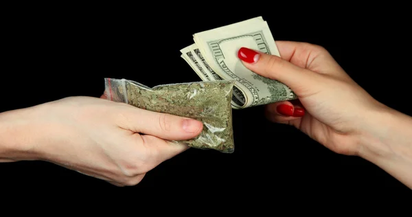 Dealer sells drug bag, isolated on black — Stock Photo, Image