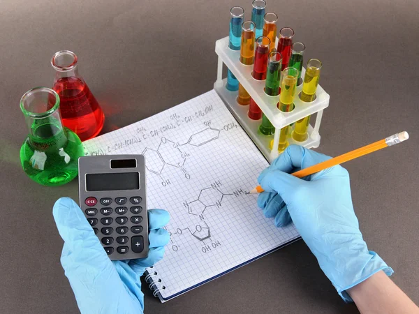 Hand scientist writing formulas — Stock Photo, Image