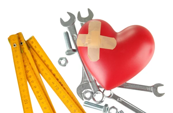 Heart and tools. Concept: Renovation of heart. Isolated on white — Stock Photo, Image