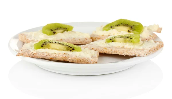 Canapes with cheese and kiwi, on color plate, isolated on white — Stock Photo, Image