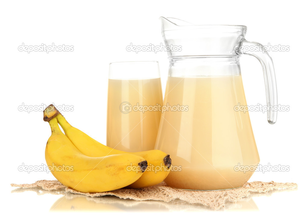 Full glass and jug of banana juice and bananas isolated on white Stock
