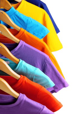 Lots of T-shirts on hangers isolated on white clipart