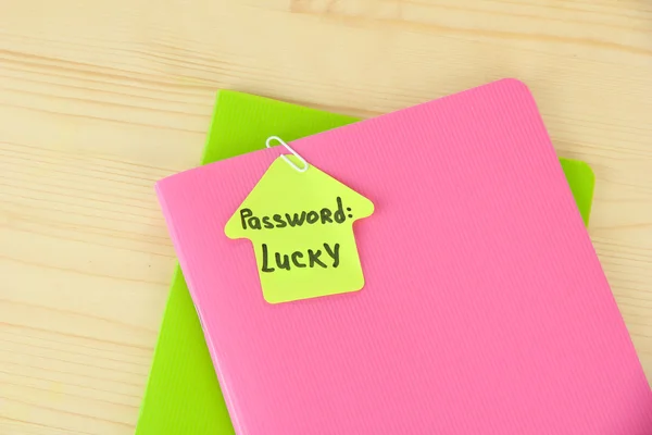 Sticker-reminder with most popular password, on notebook, on wooden background — Stock Photo, Image