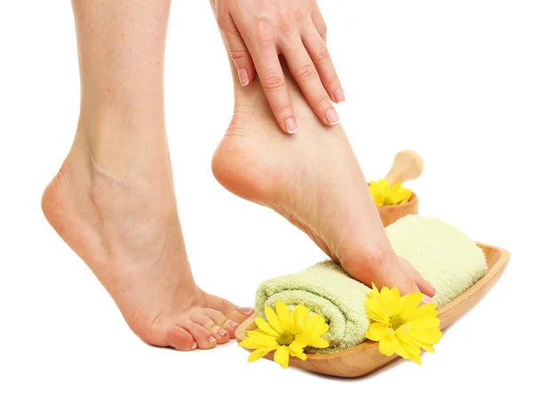 Female feet with towel - spa concept, isolated on white — Stock Photo, Image