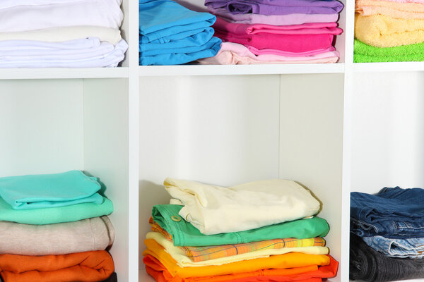 Clothes neatly folded on shelves