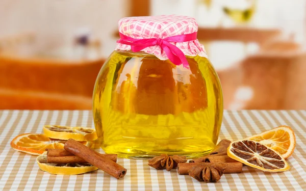 Jar of honey and dried lemon slices on bright background — Stock Photo, Image