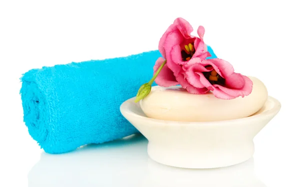 Rolled blue towel, soap bar and beautiful flower isolated on white — Stock Photo, Image