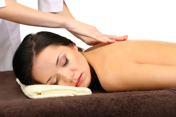 Bella giovane donna nel salone termale ottenere massaggio, isolato su bianco — Foto Stock
