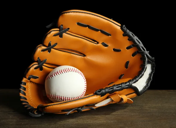 Baseball glove and ball on dark background — Stock Photo, Image