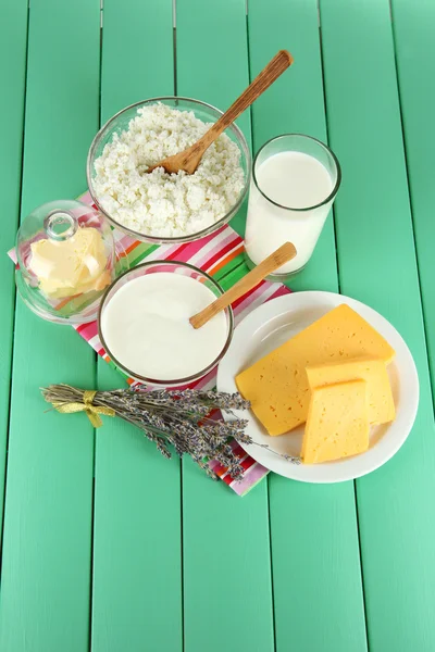 Glass of milk and cheese on a wooden background — Stock Photo, Image