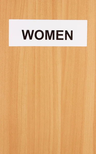 Toilet sign on wooden background — Stock Photo, Image