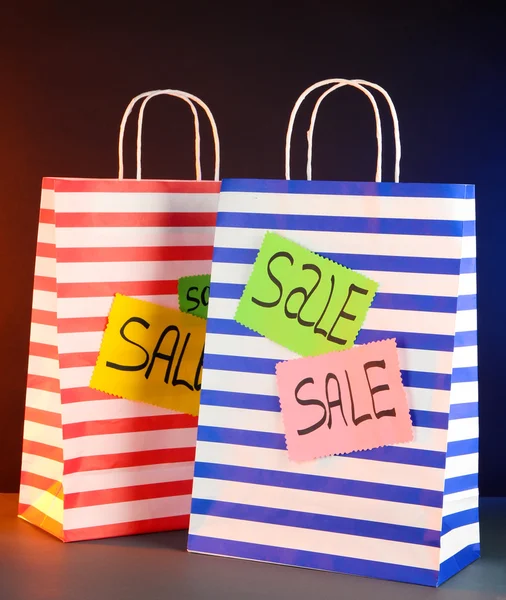 Striped bags on dark background — Stock Photo, Image