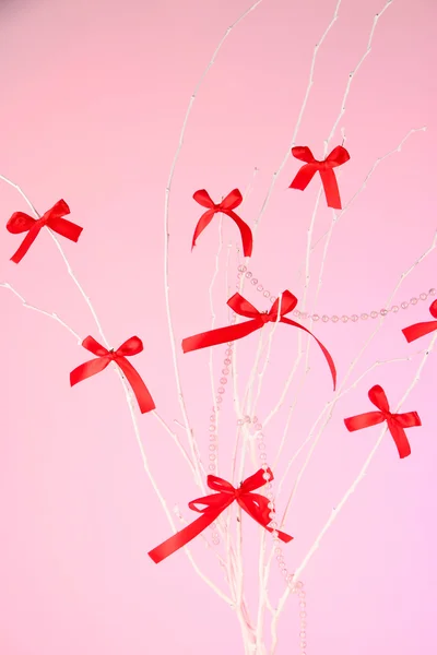 Composition from bows on pink background — Stock Photo, Image