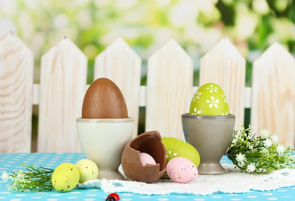 Composition of Easter and chocolate eggs on natural background — Stock Photo, Image